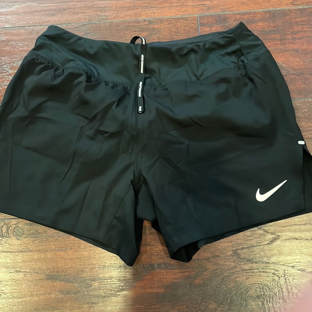 Nike woman running dri fit black shorts size small
